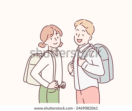 Little school children stand holding books with backpacks. Hand drawn style vector design illustrations.