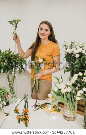 florist at work collects a white bouquet Сток-фото © 