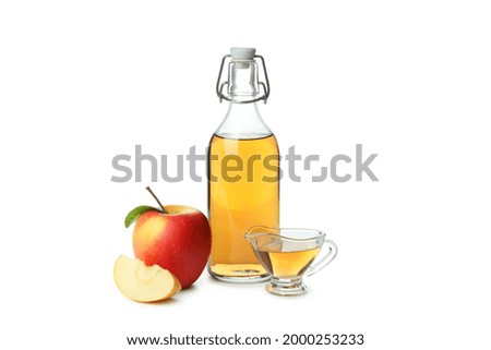 Similar – Image, Stock Photo Homemade apple vinegar in bottle with apples and green leaves on white background. Top view