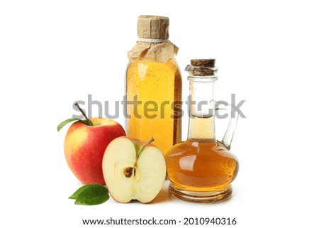 Similar – Image, Stock Photo Homemade apple vinegar in bottle with apples and green leaves on white background. Top view