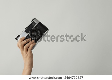 Similar – Image, Stock Photo Retro photo camera on black table with ice cubes