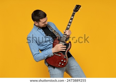 Similar – Image, Stock Photo Musician holding guitar at seaside