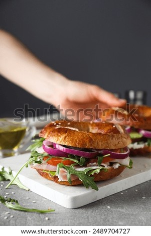 Similar – Image, Stock Photo Vegetable bagel sandwich on wooden table