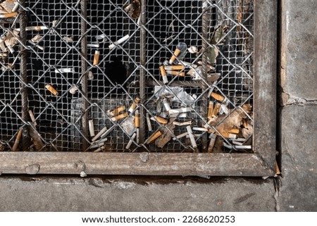 Similar – Image, Stock Photo Many cigarettes lie on the street and pollute the environment