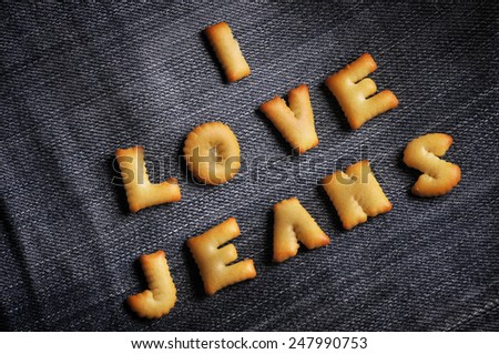 Cookies ABC in the form of word I LOVE JEANS alphabet on old jean background, Valentines day