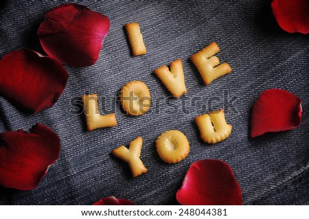 Cookies ABC in the form of word I LOVE YOU alphabet on old jean background, Valentines day