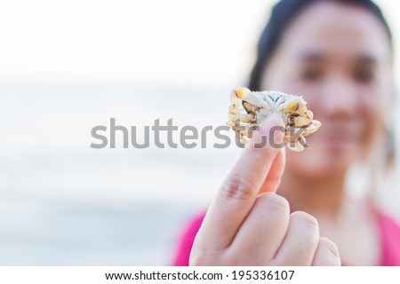 woman showing hand keeping crap on her hand