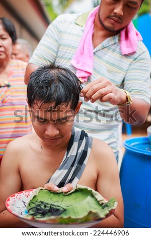 SONGKLA,THAILAND JULY 6 : Male who will be monk cut hair for be Ordained. Thailand on July 6, 2014