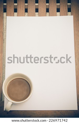 Paper on desk with coffee, vintage style