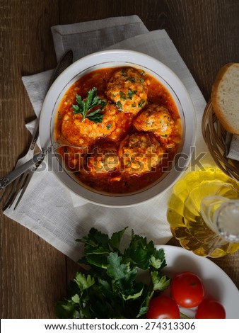 meatballs in tomato sauce, bread, tomatoes, herbs