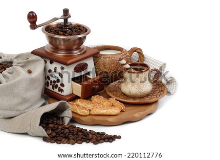Cup of fragrant coffee and coffee accessories on a white background.