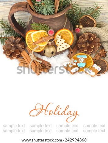 Christmas background with a jug,  ginger cookies and dried oranges.