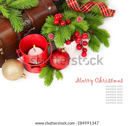 Christmas balls and red candlestick near a chest on a white background. Christmas background. Top view.