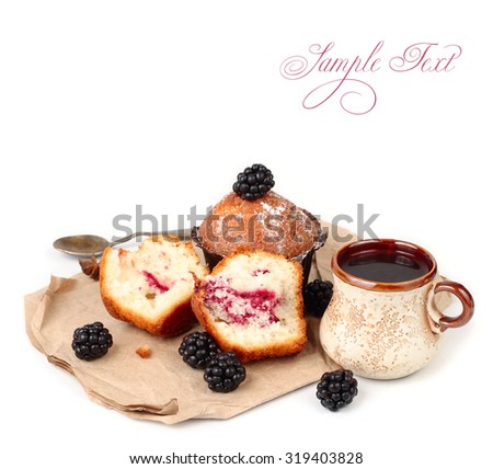 Blackberry cakes, fresh blackberry and cup of coffee on crumpled paper on a white background with a place for the text.