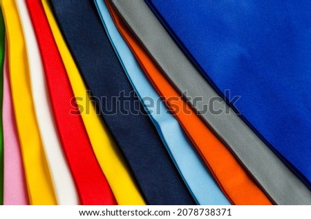 colorful non-woven fabric tote bag texture. collections made of non-woven fabrics of various colors. pile of textured and porous polypropylene material. partially visible image Photo stock © 
