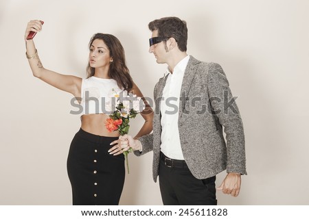 Man offering a bouquet to a woman who ignores him