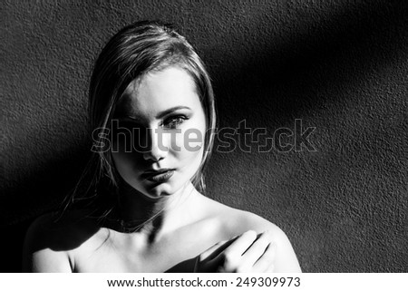Woman face in the half-light black and white
