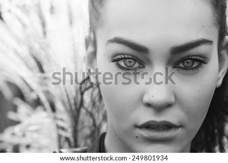 Girl with gorgeous eyes in the nature black and white
