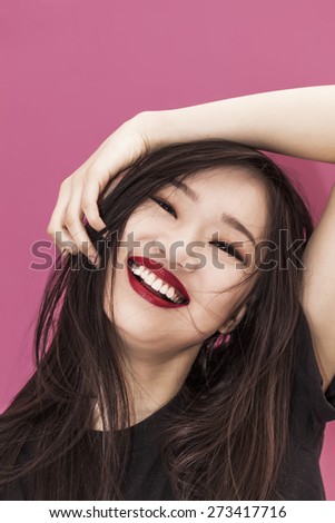 Beautiful chinese girl portrait smiling and wearing red lipstick