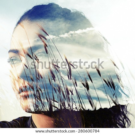 Double exposure of girl with gorgeous eyes and wheat field