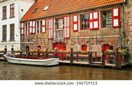 BRUGES, BELGIUM - APRIL 20: Houses along the canals of Brugge or Bruges, Belgium on April 20, 2012. Bruges is frequently referred to as 
