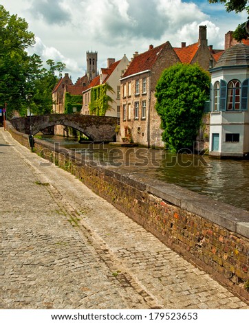BRUGES, BELGIUM - APRIL 20: Houses along the canals of Brugge or Bruges in the evening, Belgium on April 20, 2012. Bruges is frequently referred to as \