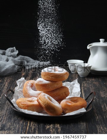 Image, Stock Photo Cooking doughnuts process. Homemade dough and deep-fried donuts, top view