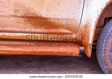 dry mud at side ladder of 4 wheel drive car