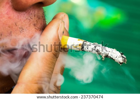 Cigarette in mouth. Bad habit, addiction, problems with health