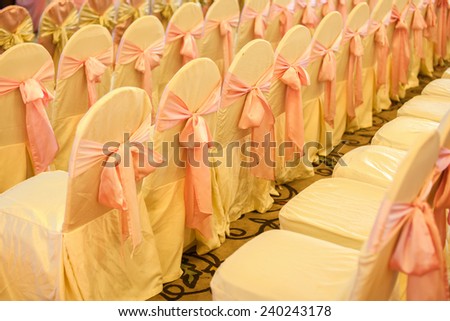 Chairs for the event or wedding reception party. Wedding table decorations in the restaurant. Valentine's Day dinner with elegant jewelry holiday heart.