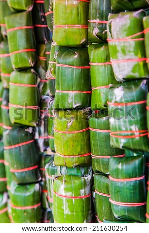 Thai style banana leaf wrapped food, made from sticky rice, pork and peanut