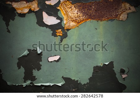 Rusty painted metal surface. Cracked iron construction background