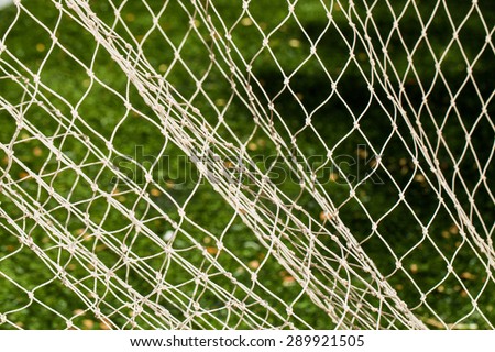 Soccer Goal Net with Green Grass Background