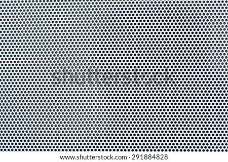 White metal plate with many small circular holes