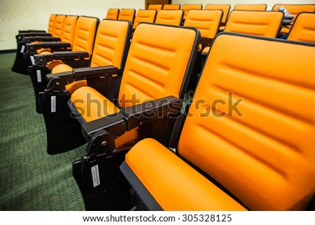 Empty movie theatre chairs background
