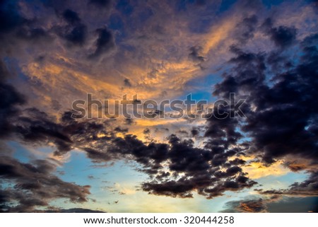 twilight sunset sky with cloudy and sunlight through clouds