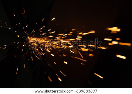 Bright blue and yellow sparks on a black background. Magical lig Сток-фото © 
