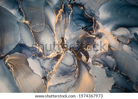 High resolution. Luxury abstract fluid art painting in alcohol ink technique, mixture of dark blue, gray and gold paints. Imitation of marble stone cut, glowing golden veins. Tender and dreamy design. Stock foto © 