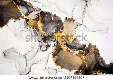 Luxury abstract fluid art painting in alcohol ink technique, mixture of black, gray and gold paints. Imitation of marble stone cut, glowing golden veins. Tender and dreamy design. Сток-фото © 