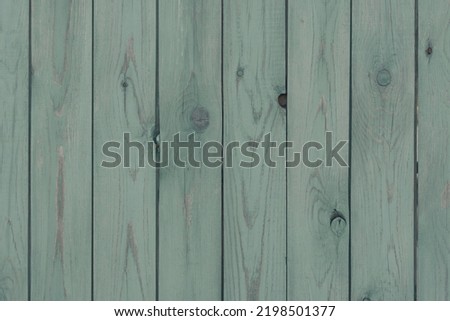 Empty clear old painted wooden background with vertical stripes, copy space. Old fashioned wood texture with scratches and scrapes. Green colored photo filter 商業照片 © 