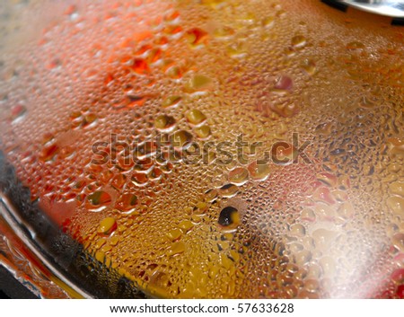 glass lid on a boiling pot with water drops
