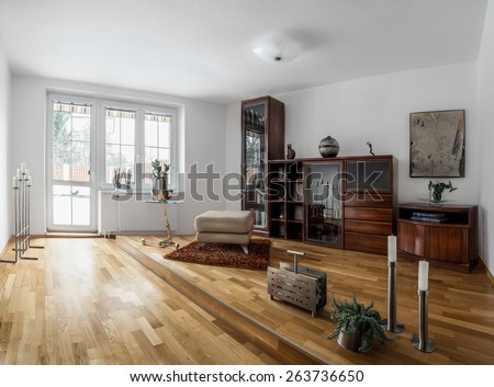 Small home modern spacious library in cool style with a variety of decorations, wooden furniture and floors