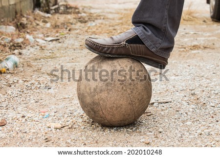 Old ball with his feet