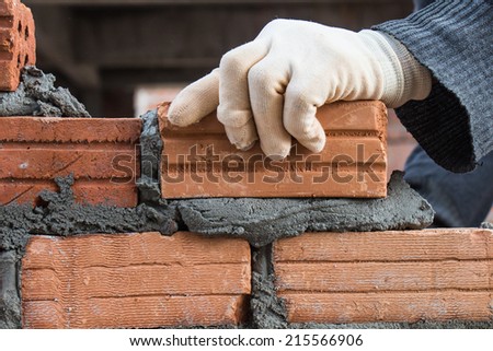 Building brick block wall on construction plant