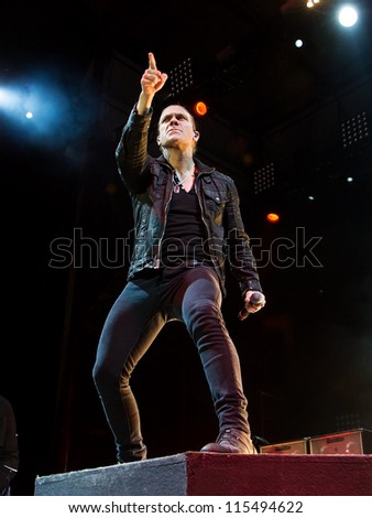 NAMPA, IDAHO - SEPTEMBER 25: Brent smith stands on stage and points to a member of the crowd at the Rockstar Uproar Festival on September 25 2012 in Nampa, Idaho