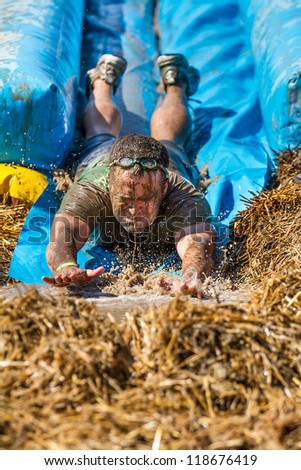 BOISE, IDAHO - AUGUST 25: Unidentified man at the bottom of the slide at the Dirty Dash August 25 2012 in Boise, Idaho