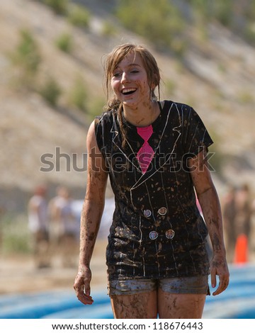 BOISE, IDAHO - AUGUST 25: Unidentified woman smiles on the course at the Dirty Dash August 25 2012 in Boise, Idaho