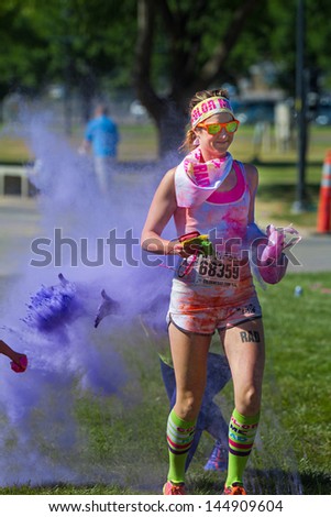 BOISE, IDAHO/USA - JUNE 22: Runner 68359 just missed being color bombed during the Color Me Rad 5k in boise on June 22, 2013