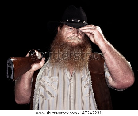 image tinted to give an older look shows an older man holding his rifle while tipping his hat to you.