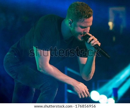 BOISE, IDAHO/USA - FEBRUARY 8, 2013: Dan Reynolds bends over to sing to the crowd during the Night Visions Tour